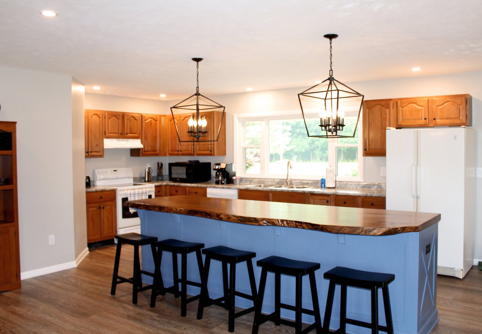 Kitchen with live-edge island and seating for five
